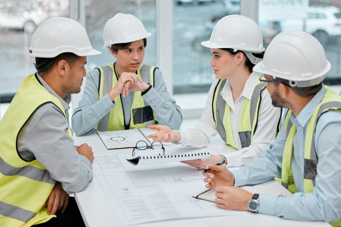 Construction engineers planning waste management strategy